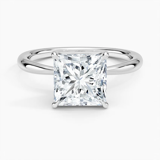 Princess cut moissanite engagement ring on a sleek silver band, solitaire setting