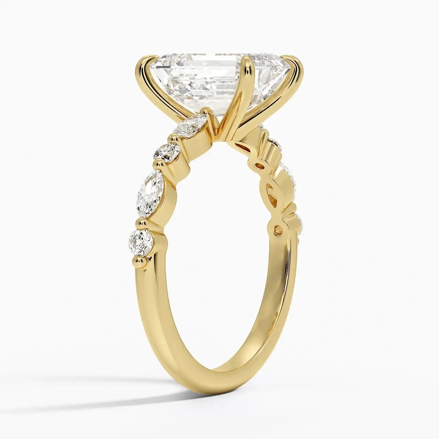 Gold moissanite engagement ring with large center stone and marquise side stones