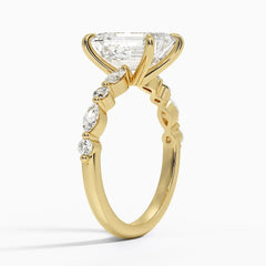 Gold moissanite engagement ring with large center stone and marquise side stones