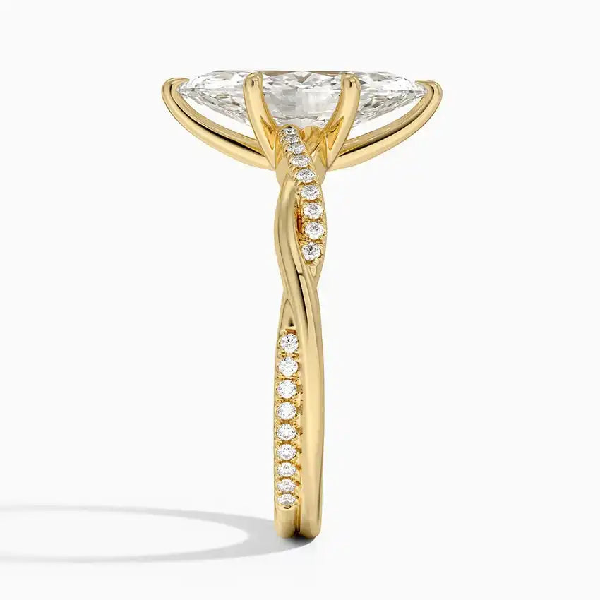 Gold moissanite engagement ring with pavé band and twisted setting, side view