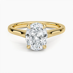 Oval moissanite engagement ring with gold band, solitaire setting, sparkling brilliance