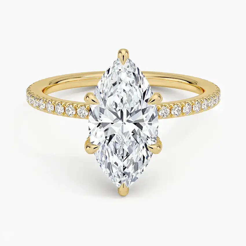 Marquise cut moissanite engagement ring with pavé diamond band in yellow gold setting