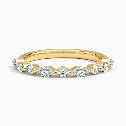 Gold band ring with round and marquise cut moissanite stones, elegant fine jewelry