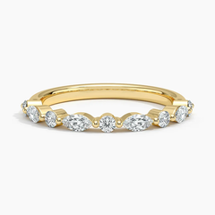 Gold band ring with round and marquise cut moissanite stones, elegant fine jewelry