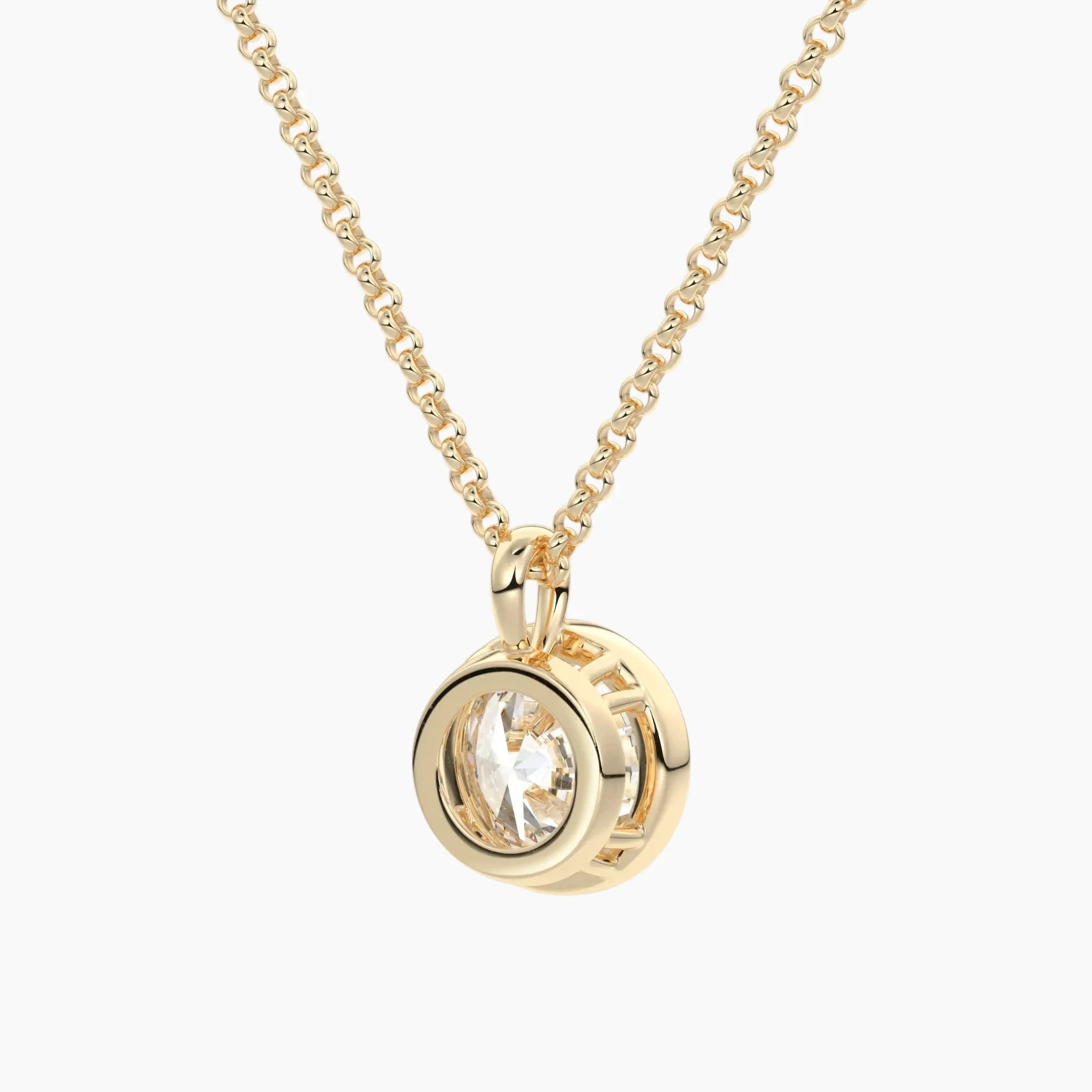 Gold moissanite pendant necklace with round brilliant stone in bezel setting on chain
