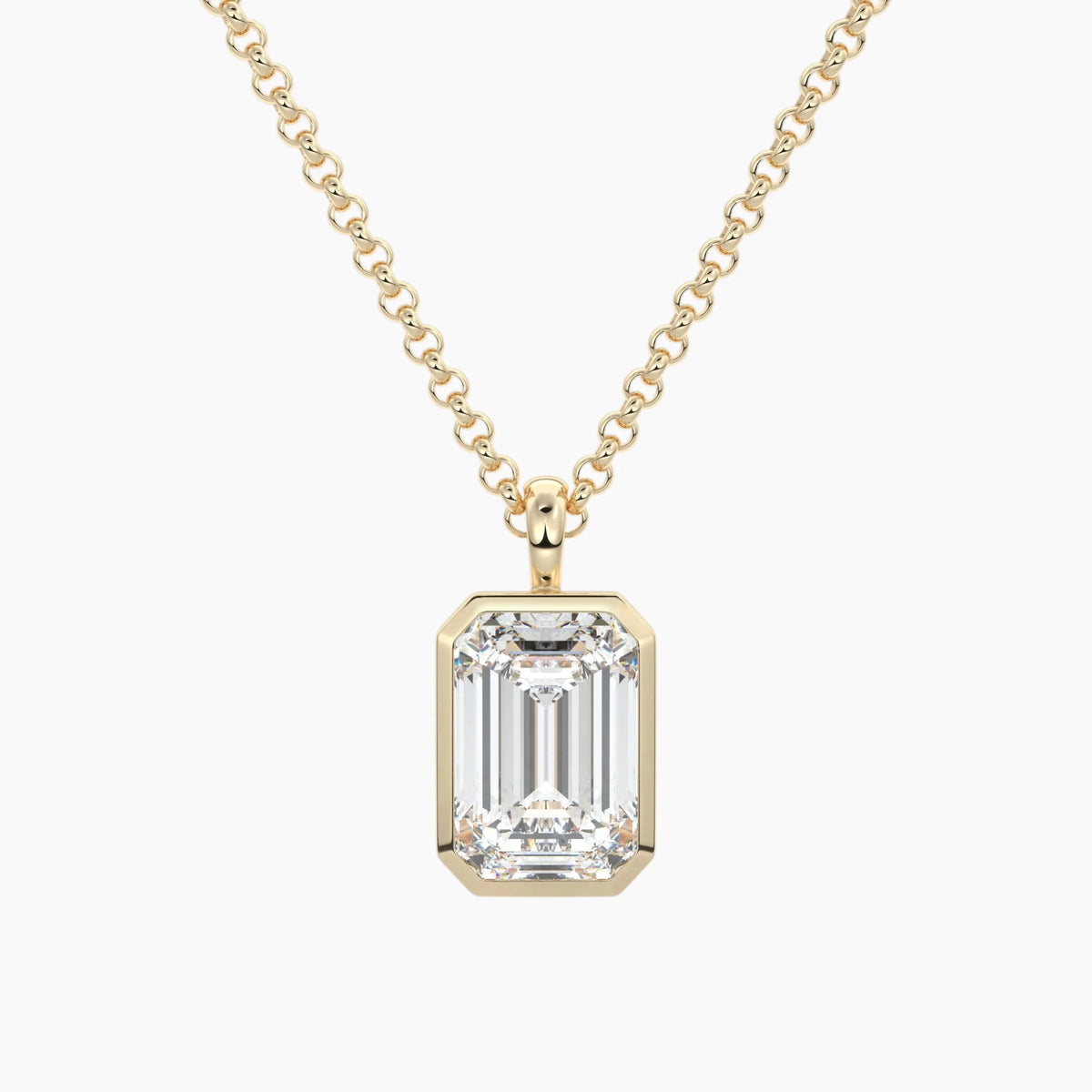 Emerald cut moissanite pendant necklace in yellow gold setting on a chain