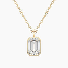 Emerald cut moissanite pendant necklace in yellow gold setting on a chain