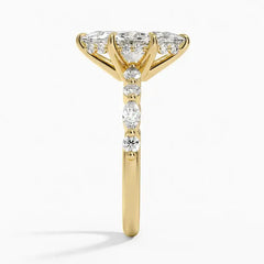 Gold band ring with sparkling moissanite stones in a prong setting, side view
