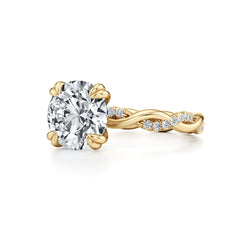 Gold moissanite engagement ring with twisted band and round brilliant center stone