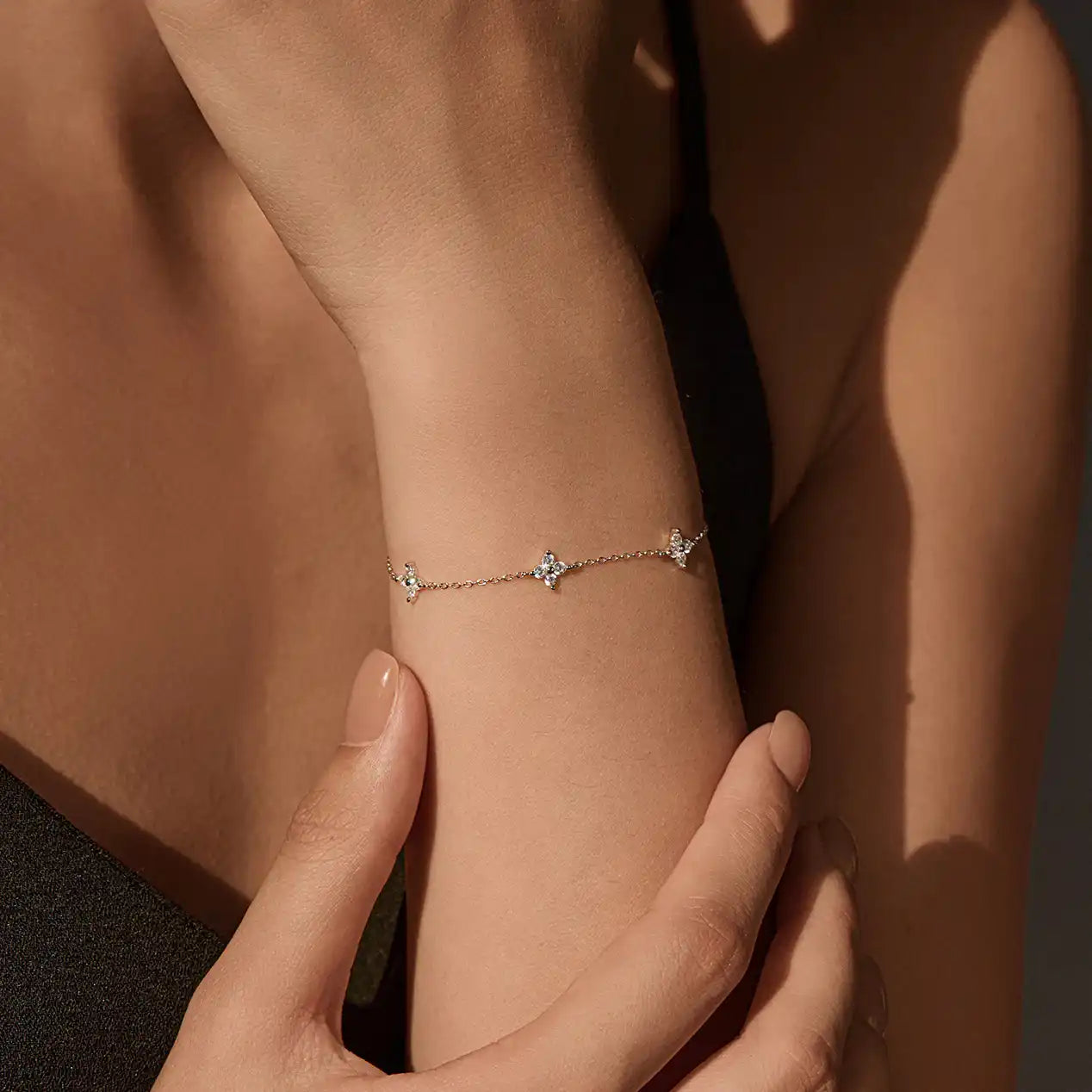 Delicate moissanite bracelet with diamond-like sparkle on a woman's wrist