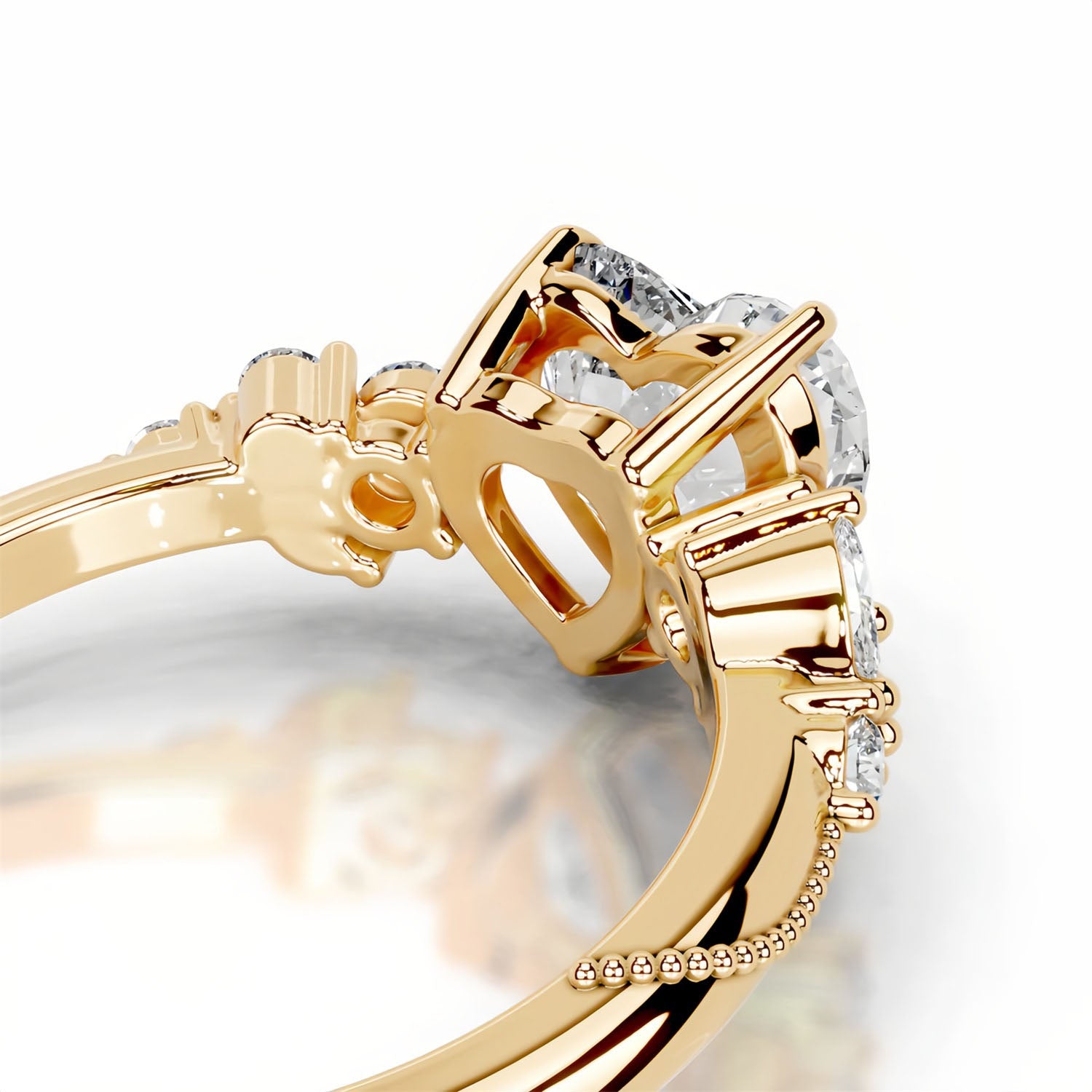 Close-up of gold moissanite ring with heart-shaped setting and sparkling stones
