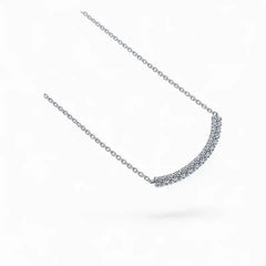 Moissanite curved bar necklace with round gemstones on a delicate silver chain