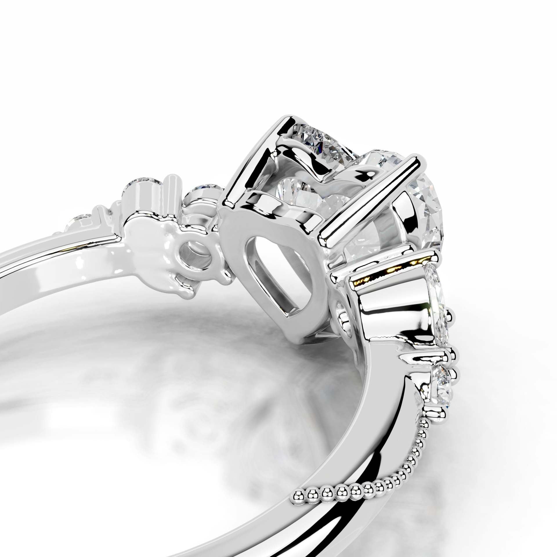 Close-up of silver moissanite ring with prong-set gemstones and intricate detailing