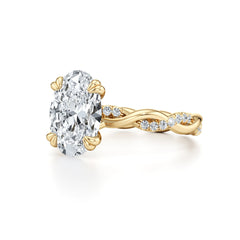 Oval moissanite gold ring with diamond accent twisted band, elegant fine jewelry