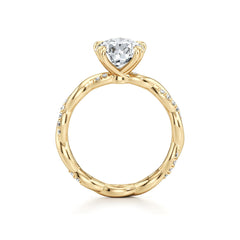Gold moissanite engagement ring with bamboo-inspired band and sparkling accent stones