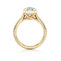 Gold moissanite engagement ring with pave band and radiant cut center stone