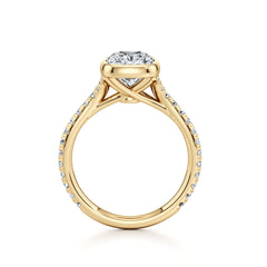 Gold moissanite engagement ring with pavé band and round brilliant center stone