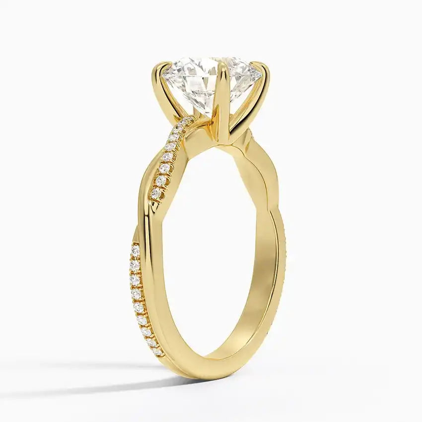 Gold moissanite engagement ring with pavé band and solitaire center stone