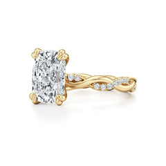 Cushion cut moissanite engagement ring with twisted gold band and side stones