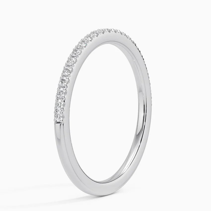 Slim silver moissanite eternity band with pavé-set stones on a white background