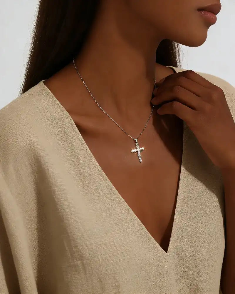 Woman wearing moissanite cross pendant necklace, elegant jewelry for special occasions