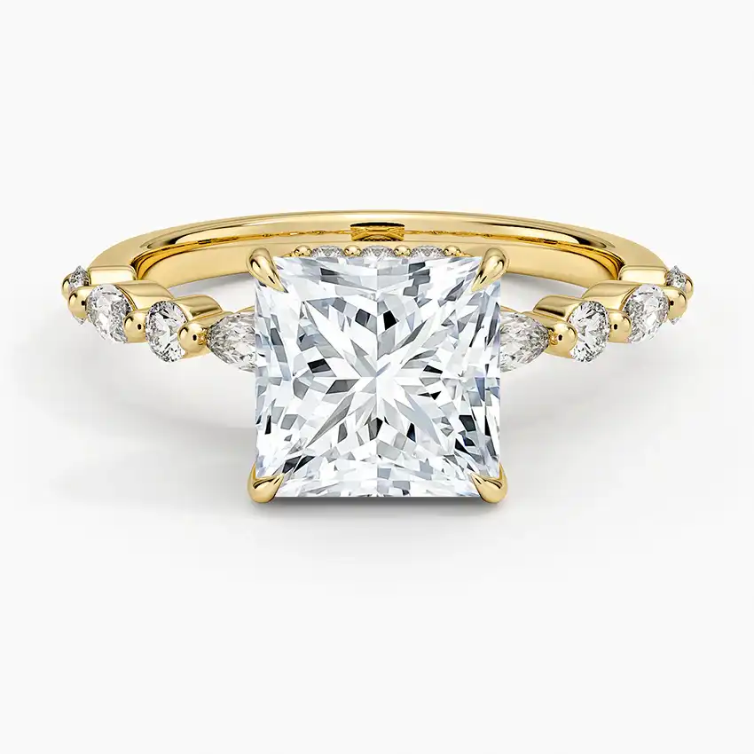 Princess cut moissanite engagement ring with gold band and side stones
