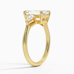 Gold moissanite engagement ring with emerald-cut center stone and marquise side stones