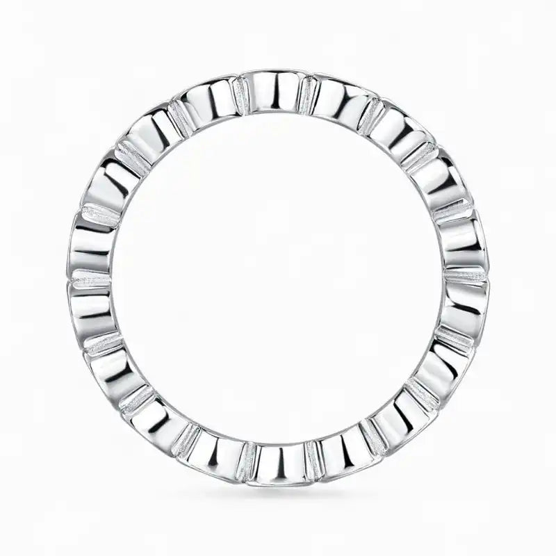 Silver moissanite eternity ring with geometric design on white background