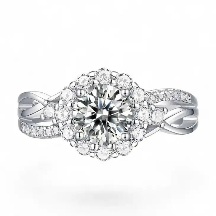 Halo moissanite engagement ring with round center stone and pavé diamond-like accents on silver band