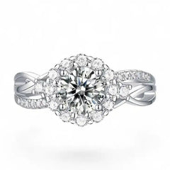 Halo moissanite engagement ring with round center stone and pavé diamond-like accents on silver band