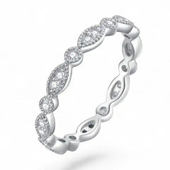 Silver moissanite eternity ring with marquise and round settings, sparkling pavé accents
