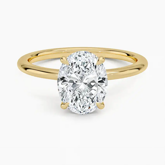 Oval cut moissanite solitaire engagement ring with yellow gold band