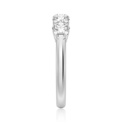 Side view of a white gold ring with two round moissanite stones in a prong setting