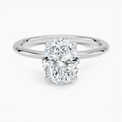 Oval cut moissanite solitaire engagement ring with minimalist silver band