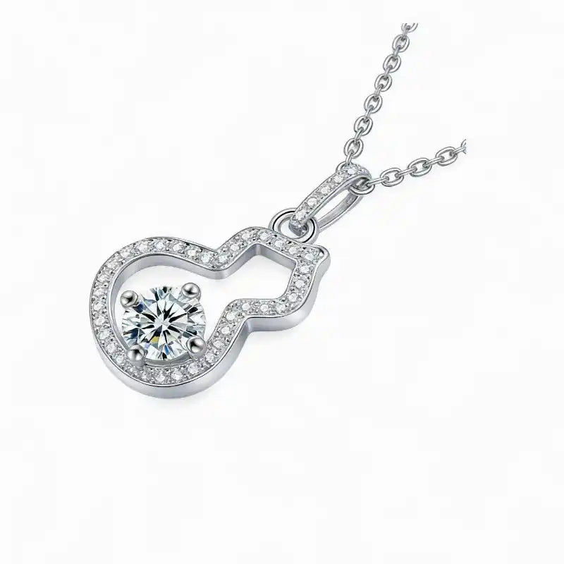 Sterling silver pendant necklace with a round moissanite center stone and pavé accents