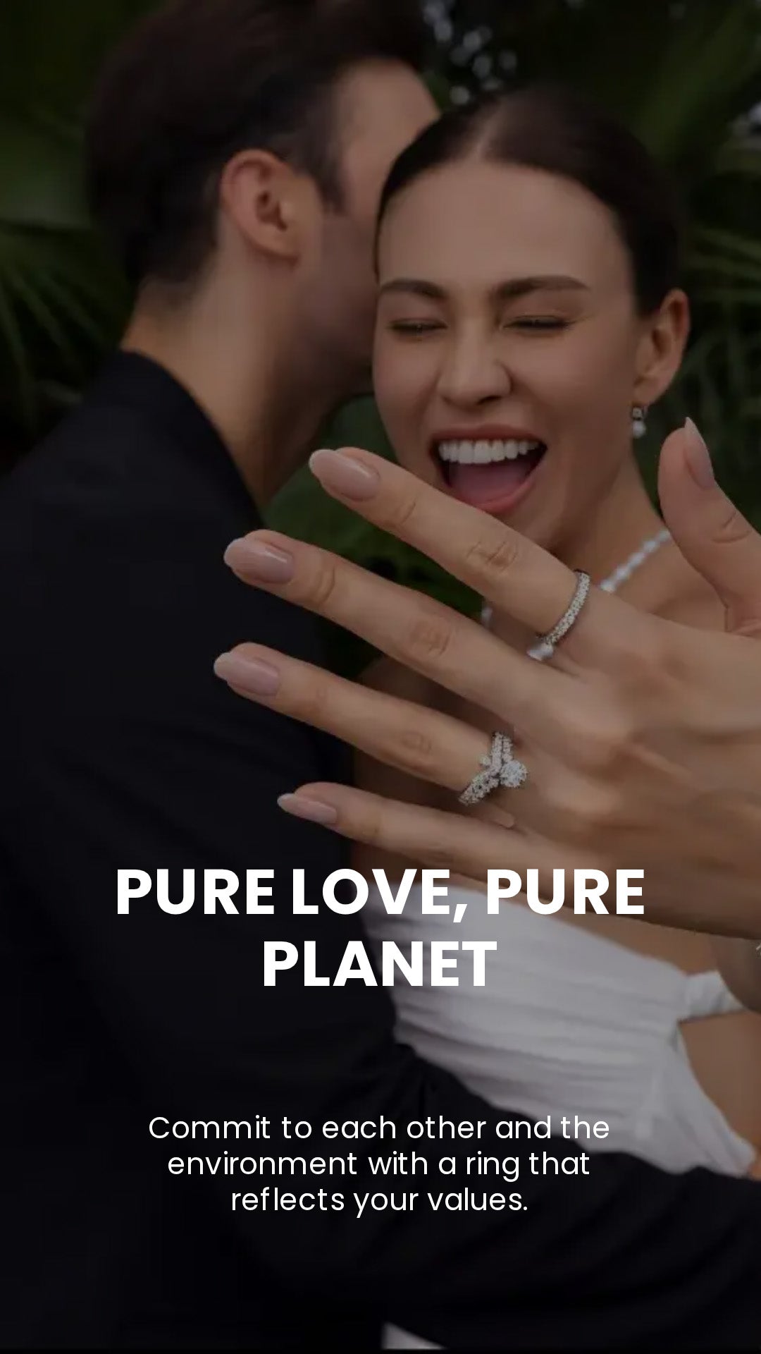 Smiling woman showing moissanite engagement and wedding rings outdoors with partner