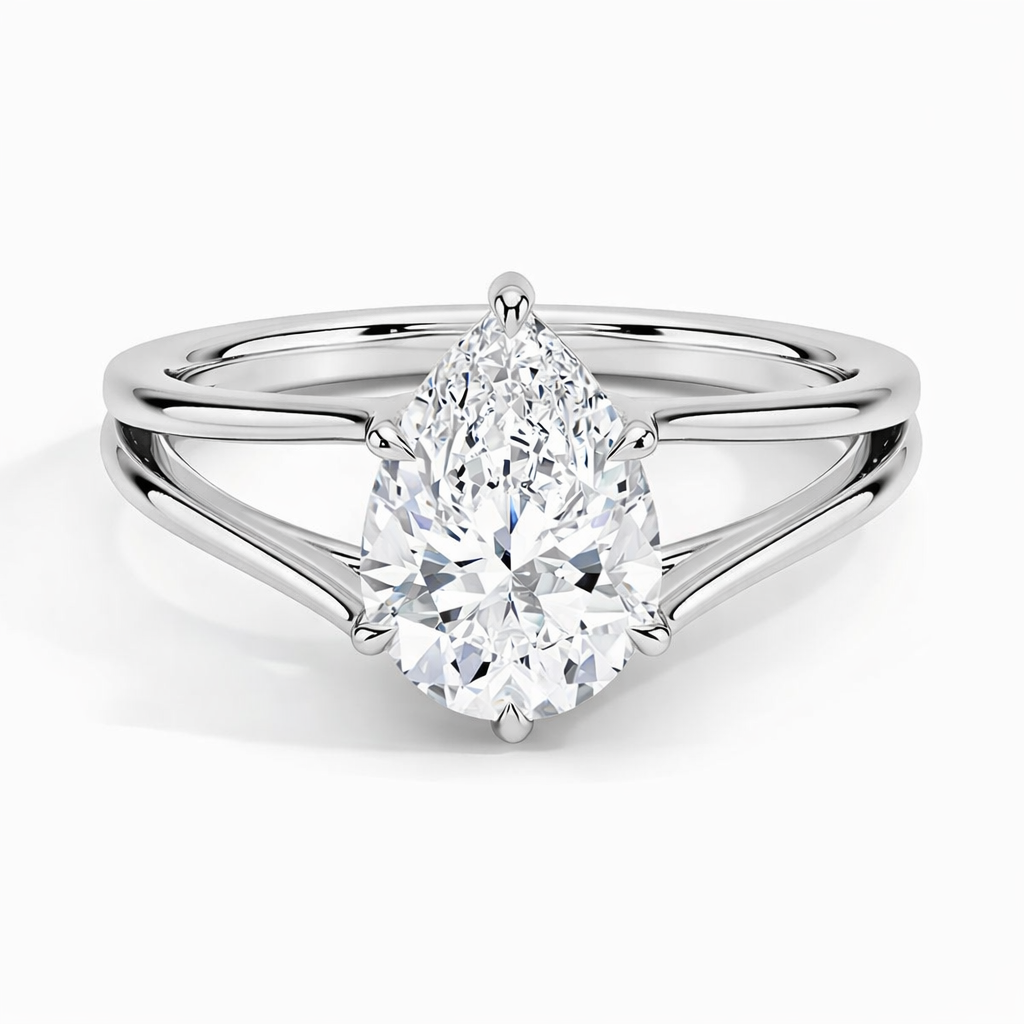 Pear-shaped moissanite solitaire ring with split shank in polished silver setting