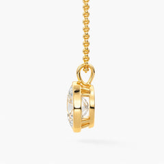 Gold moissanite pendant necklace with round brilliant gemstone on a gold chain