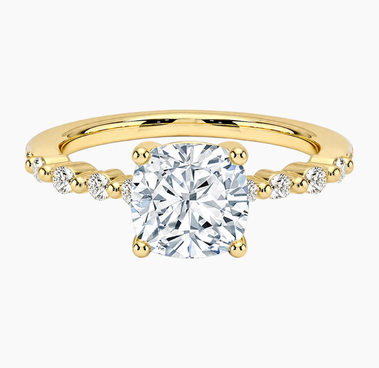 Cushion-cut moissanite ring featuring an 18K white gold-plated band set with pavé diamonds; an elegant solitaire-style engagement ring.