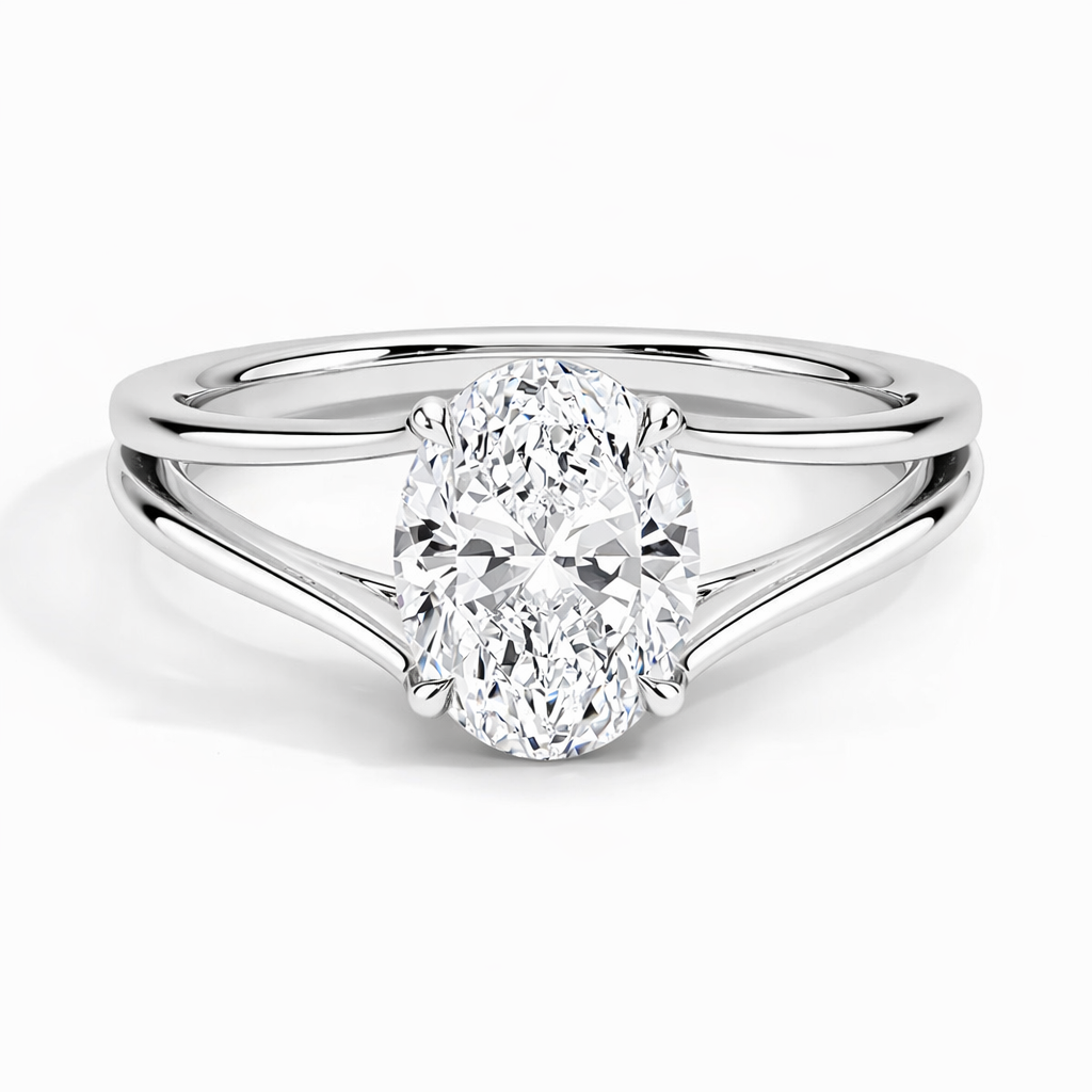 Oval moissanite engagement ring with split shank setting in polished white metal