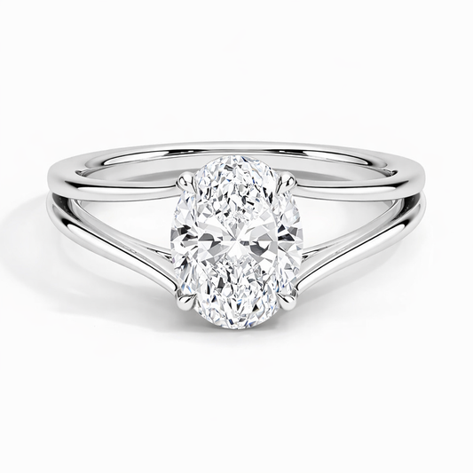 Oval moissanite engagement ring with split shank setting in polished white metal