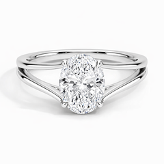 Oval moissanite engagement ring with split shank setting in polished white metal