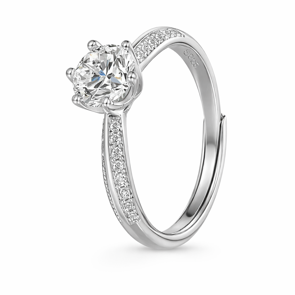 Silver moissanite engagement ring with pavé band and round brilliant center stone