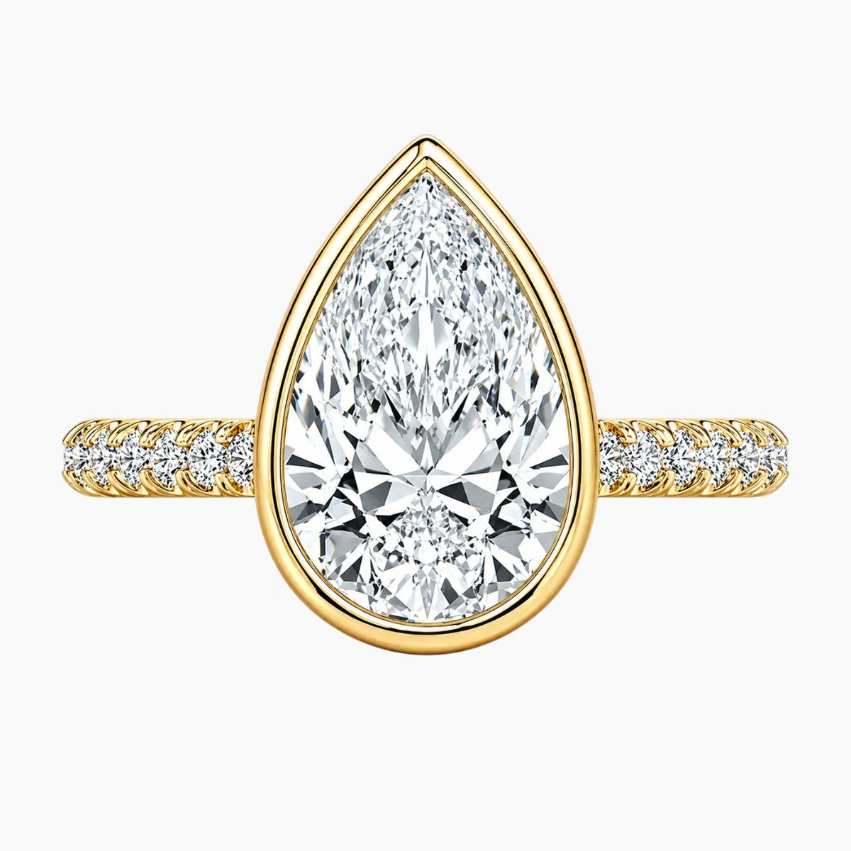 Yellow gold ring with pear-shaped moissanite center stone and pavé band