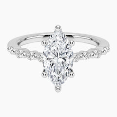 Marquise-cut moissanite ring featuring an 18K white gold-plated band set with pavé diamonds; an elegant solitaire-style engagement ring.