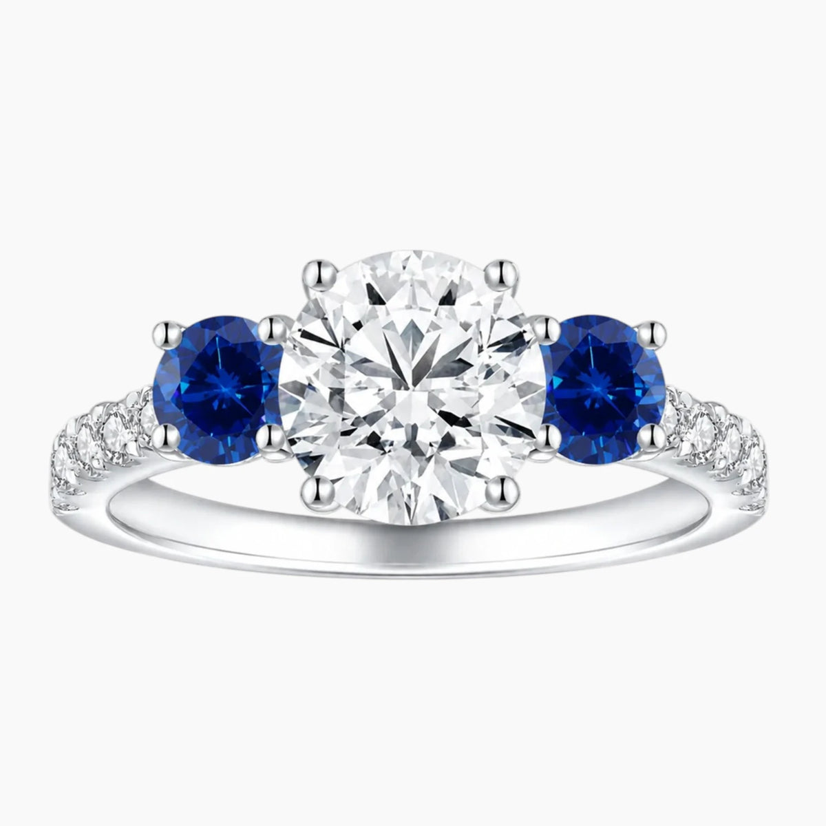 Midnight Sky Three-Stone Moissanite Ring with Blue Sapphire Accents