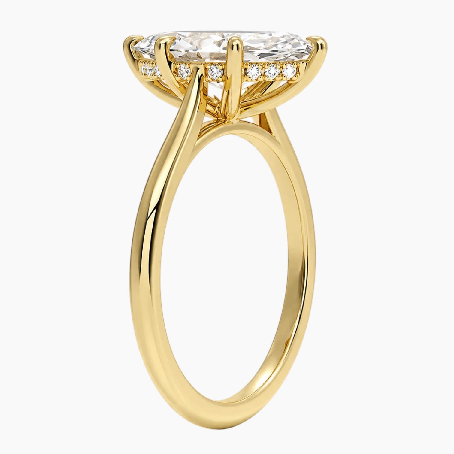 Rear view of an oval moissanite cathedral engagement ring in yellow gold with a hidden halo.