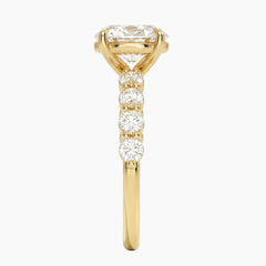 Oval-cut moissanite ring featuring an 18K white gold-plated band set with pavé diamonds; an elegant solitaire-style engagement ring.