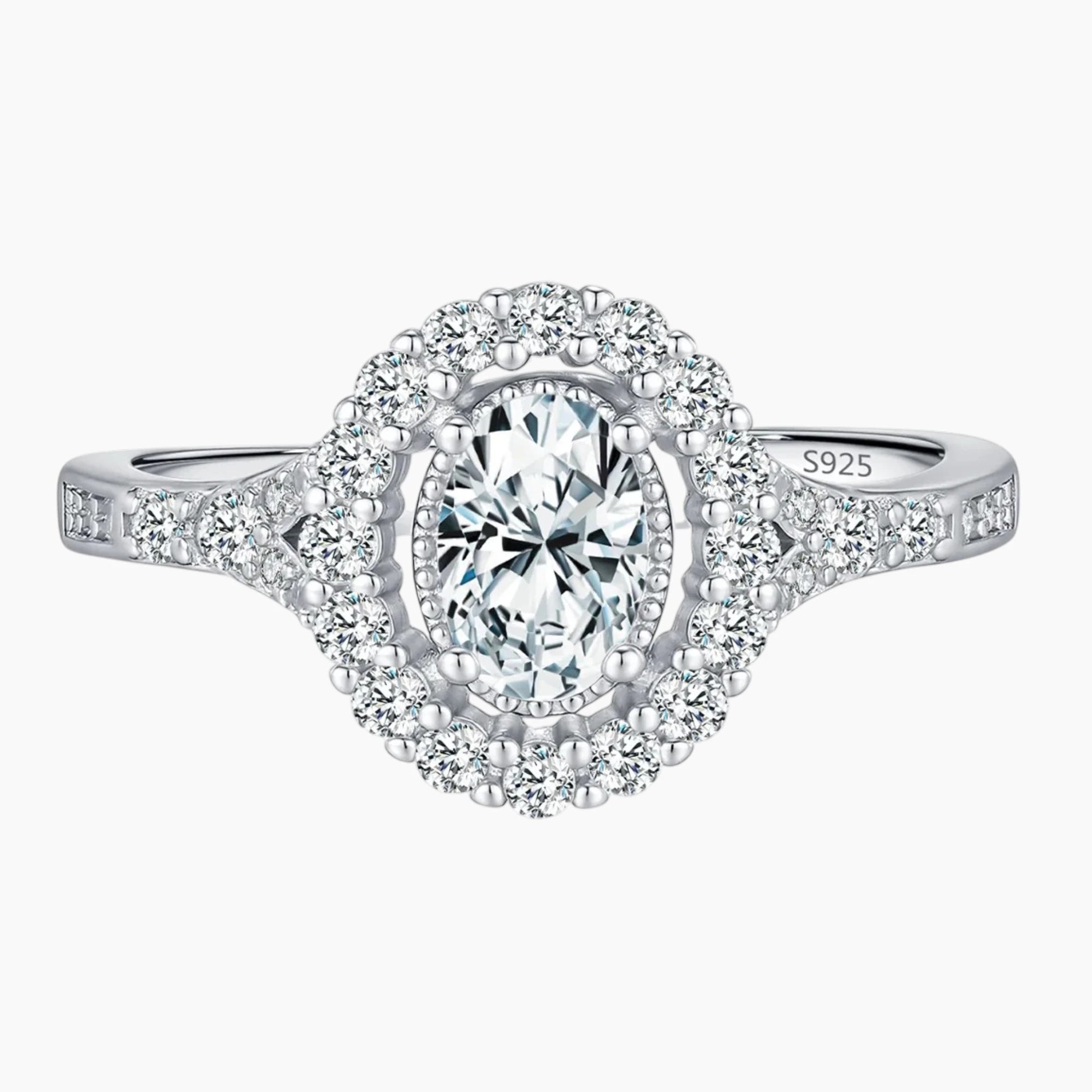 Oval cut moissanite halo engagement ring in sterling silver with pavé band