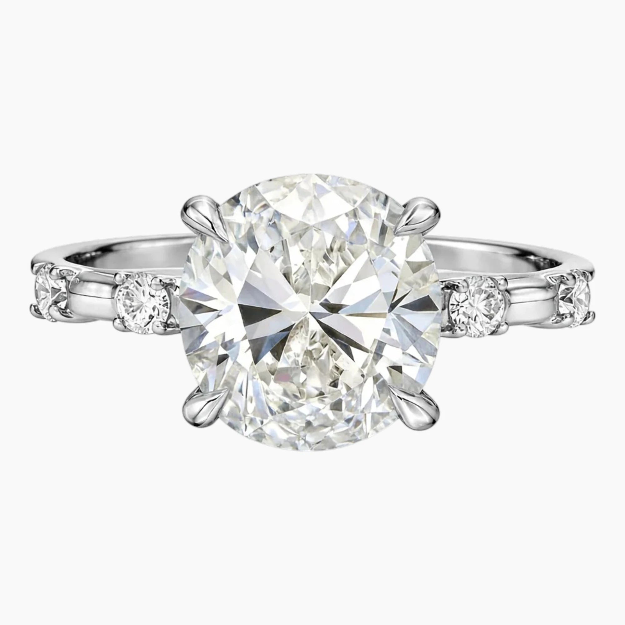 Oval moissanite engagement ring with side stones in white gold setting